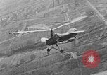 Image of Autogiro lands and takes off at a seaport United States USA, 1934, second 11 stock footage video 65675072923