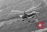 Image of Autogiro lands and takes off at a seaport United States USA, 1934, second 12 stock footage video 65675072923