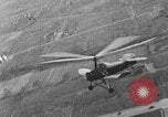 Image of Autogiro lands and takes off at a seaport United States USA, 1934, second 13 stock footage video 65675072923