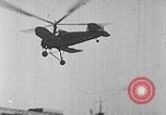 Image of Autogiro lands and takes off at a seaport United States USA, 1934, second 15 stock footage video 65675072923