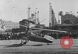 Image of Autogiro lands and takes off at a seaport United States USA, 1934, second 21 stock footage video 65675072923