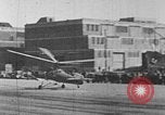 Image of Autogiro lands and takes off at a seaport United States USA, 1934, second 25 stock footage video 65675072923