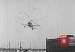 Image of Autogiro lands and takes off at a seaport United States USA, 1934, second 28 stock footage video 65675072923