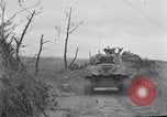 Image of US armor and infantry advancing in Ryukyu Campaign Pacific Theater, 1945, second 22 stock footage video 65675072977