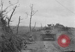 Image of US armor and infantry advancing in Ryukyu Campaign Pacific Theater, 1945, second 24 stock footage video 65675072977