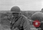 Image of US armor and infantry advancing in Ryukyu Campaign Pacific Theater, 1945, second 45 stock footage video 65675072977
