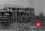 Image of school construction and suburban homes Washington DC USA, 1950, second 8 stock footage video 65675073233
