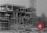 Image of school construction and suburban homes Washington DC USA, 1950, second 9 stock footage video 65675073233