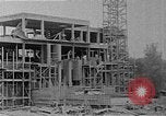 Image of school construction and suburban homes Washington DC USA, 1950, second 11 stock footage video 65675073233
