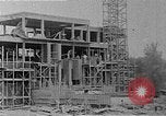 Image of school construction and suburban homes Washington DC USA, 1950, second 12 stock footage video 65675073233