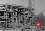 Image of school construction and suburban homes Washington DC USA, 1950, second 13 stock footage video 65675073233