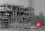 Image of school construction and suburban homes Washington DC USA, 1950, second 14 stock footage video 65675073233
