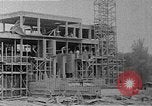 Image of school construction and suburban homes Washington DC USA, 1950, second 15 stock footage video 65675073233