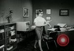 Image of woman worker arguing with boss United States USA, 1965, second 43 stock footage video 65675073400