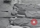 Image of emaciated corpses Germany, 1945, second 1 stock footage video 65675073860
