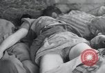 Image of dead bodies of inmates Germany, 1945, second 26 stock footage video 65675073862