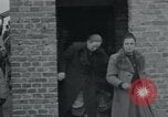 Image of German civilians view dead at Wöbbelin Concentration Camp Ludwigslust Germany, 1945, second 16 stock footage video 65675073876