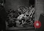 Image of pile of emaciated corpses Germany, 1945, second 10 stock footage video 65675073907