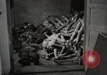 Image of pile of emaciated corpses Germany, 1945, second 18 stock footage video 65675073907