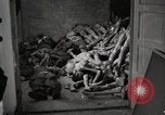 Image of pile of emaciated corpses Germany, 1945, second 27 stock footage video 65675073907