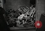 Image of pile of emaciated corpses Germany, 1945, second 31 stock footage video 65675073907