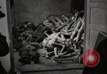 Image of pile of emaciated corpses Germany, 1945, second 58 stock footage video 65675073907