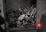 Image of pile of emaciated corpses Germany, 1945, second 59 stock footage video 65675073907