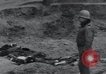 Image of unburied bodies of victims Germany, 1945, second 10 stock footage video 65675073912