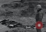Image of unburied bodies of victims Germany, 1945, second 11 stock footage video 65675073912