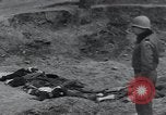 Image of unburied bodies of victims Germany, 1945, second 16 stock footage video 65675073912