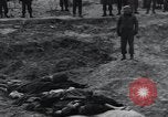Image of unburied bodies of victims Germany, 1945, second 26 stock footage video 65675073912