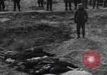 Image of unburied bodies of victims Germany, 1945, second 27 stock footage video 65675073912