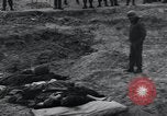 Image of unburied bodies of victims Germany, 1945, second 36 stock footage video 65675073912