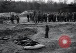 Image of unburied bodies of victims Germany, 1945, second 46 stock footage video 65675073912