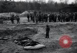 Image of unburied bodies of victims Germany, 1945, second 47 stock footage video 65675073912