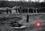 Image of unburied bodies of victims Germany, 1945, second 48 stock footage video 65675073912