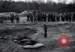 Image of unburied bodies of victims Germany, 1945, second 51 stock footage video 65675073912
