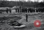 Image of unburied bodies of victims Germany, 1945, second 52 stock footage video 65675073912