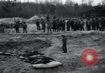 Image of unburied bodies of victims Germany, 1945, second 53 stock footage video 65675073912