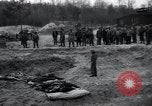 Image of unburied bodies of victims Germany, 1945, second 57 stock footage video 65675073912