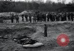 Image of unburied bodies of victims Germany, 1945, second 61 stock footage video 65675073912