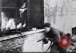 Image of Soviet soldier with  PPSh sub machine gun pulls German soldier from cellar Berlin Germany, 1945, second 1 stock footage video 65675074103