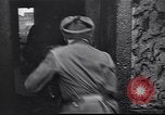 Image of Soviet soldier with  PPSh sub machine gun pulls German soldier from cellar Berlin Germany, 1945, second 4 stock footage video 65675074103