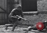 Image of Soviet soldier with  PPSh sub machine gun pulls German soldier from cellar Berlin Germany, 1945, second 12 stock footage video 65675074103