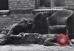 Image of Soviet soldier with  PPSh sub machine gun pulls German soldier from cellar Berlin Germany, 1945, second 14 stock footage video 65675074103