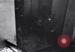 Image of Soviet soldier with  PPSh sub machine gun pulls German soldier from cellar Berlin Germany, 1945, second 18 stock footage video 65675074103