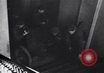 Image of Soviet soldier with  PPSh sub machine gun pulls German soldier from cellar Berlin Germany, 1945, second 19 stock footage video 65675074103