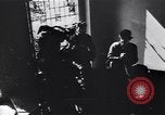 Image of Soviet soldier with  PPSh sub machine gun pulls German soldier from cellar Berlin Germany, 1945, second 21 stock footage video 65675074103