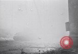 Image of Soviet soldier with  PPSh sub machine gun pulls German soldier from cellar Berlin Germany, 1945, second 27 stock footage video 65675074103