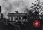 Image of Soviet soldier with  PPSh sub machine gun pulls German soldier from cellar Berlin Germany, 1945, second 30 stock footage video 65675074103